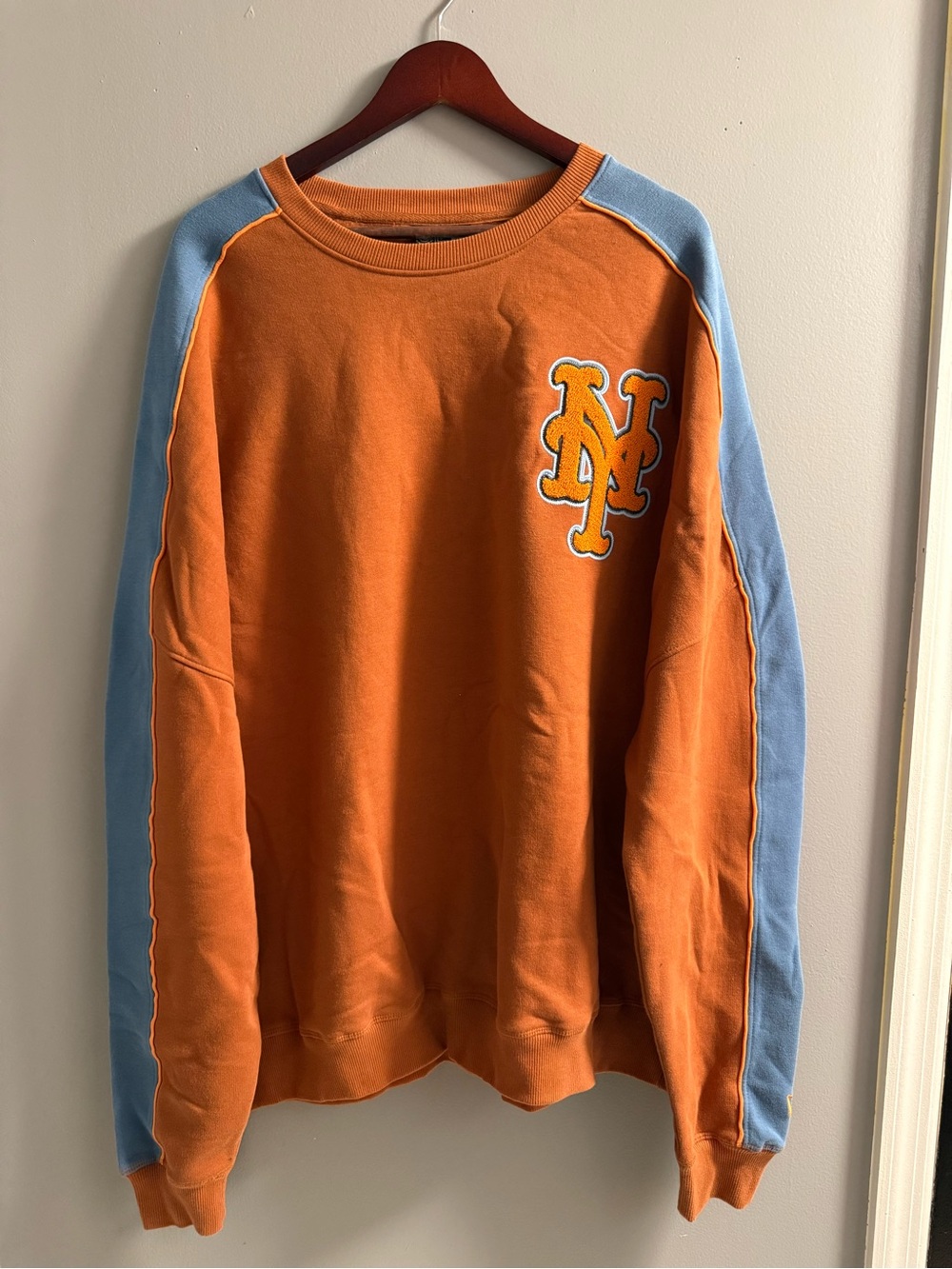 New Era Orange Crewneck with Light Blue Sleeves